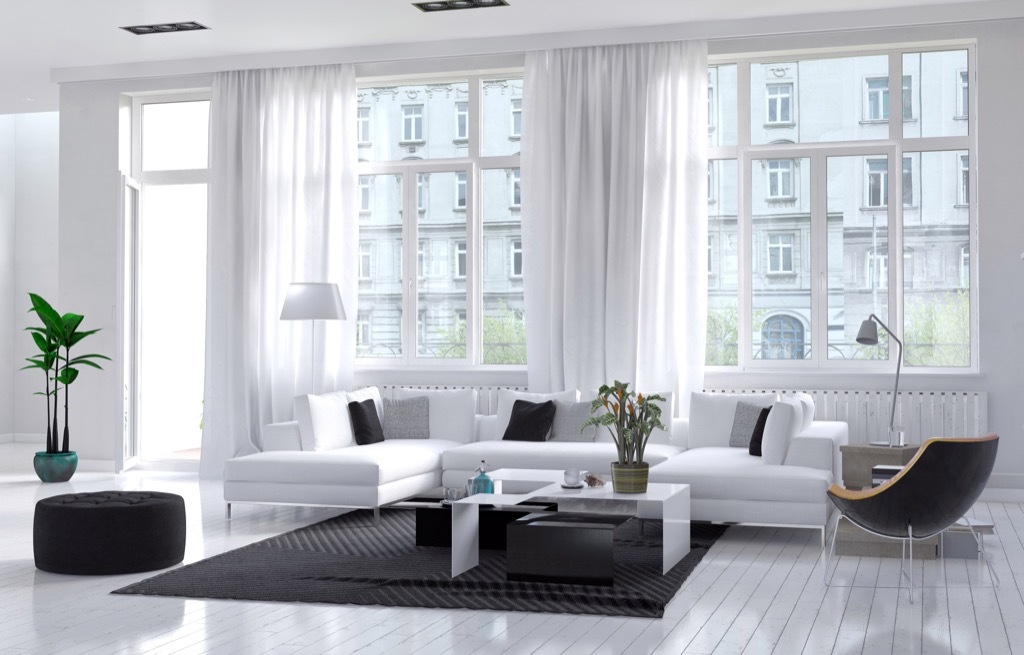 bright white living room with a large rug