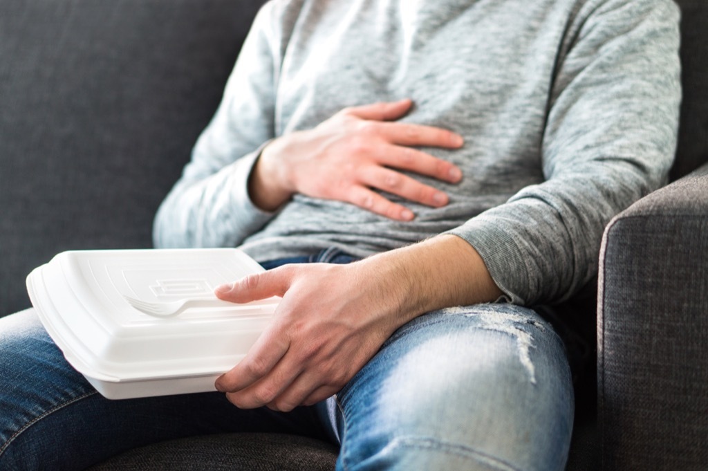 man feeling full not hungry