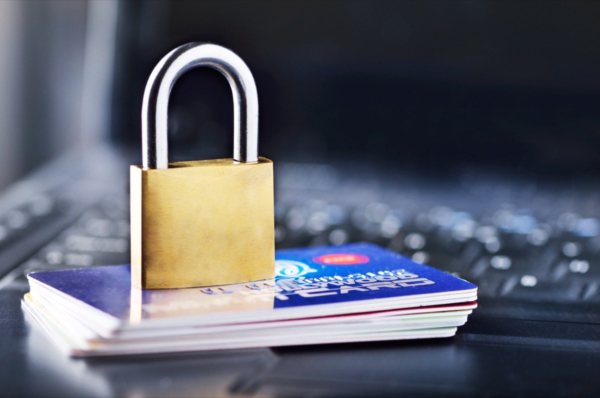 padlock sitting on credit cards