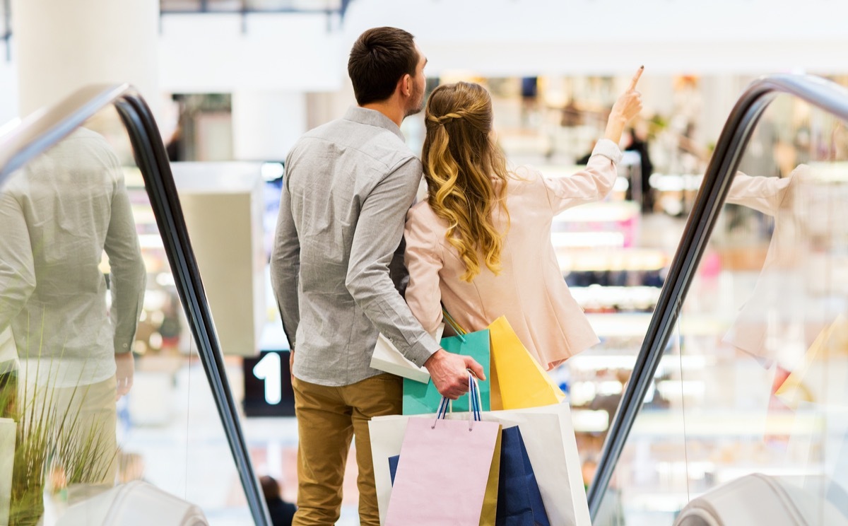 Couple on mall escalator