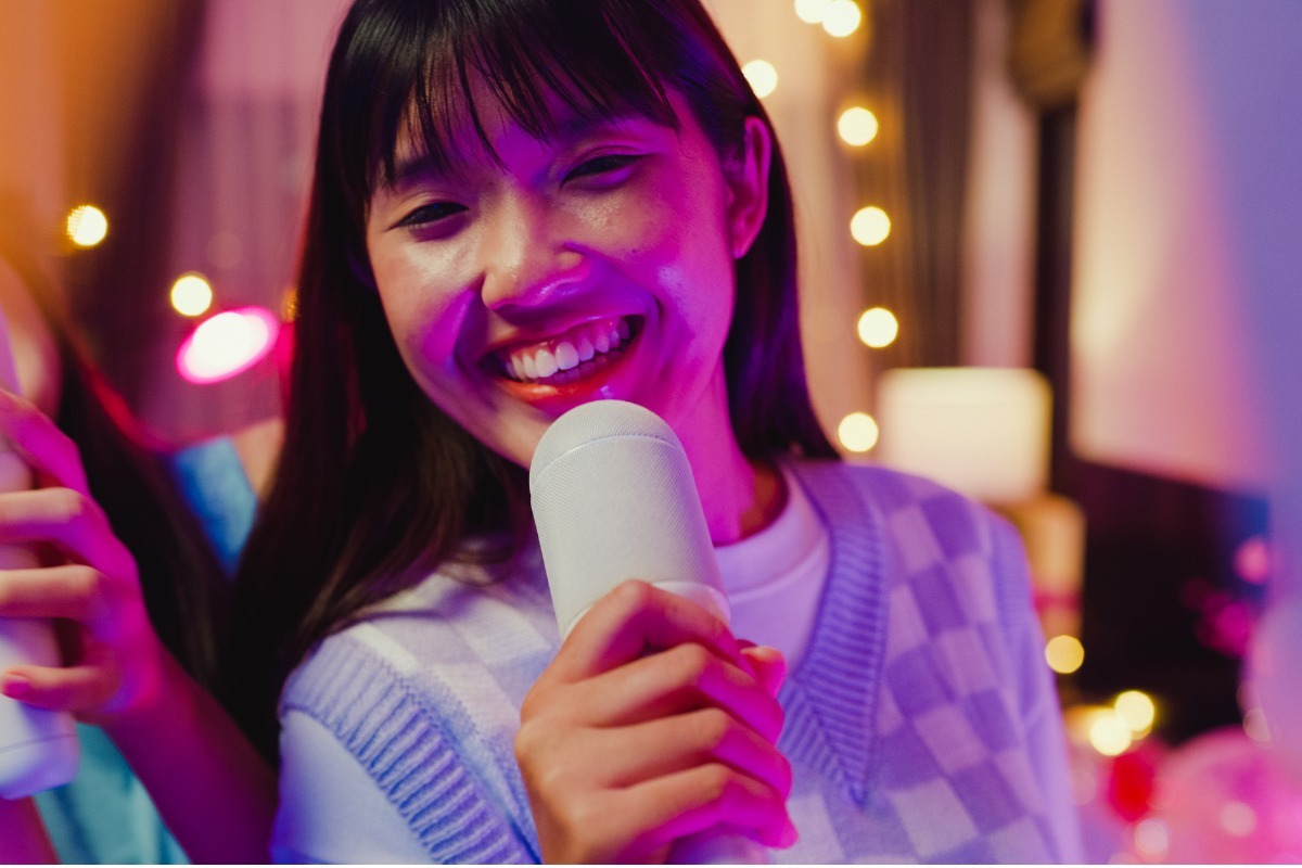 young woman singing karaoke