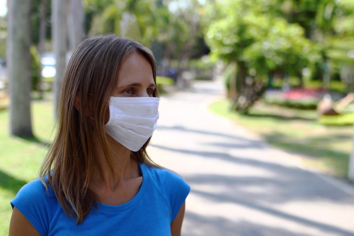 Woman wearing a mask outside