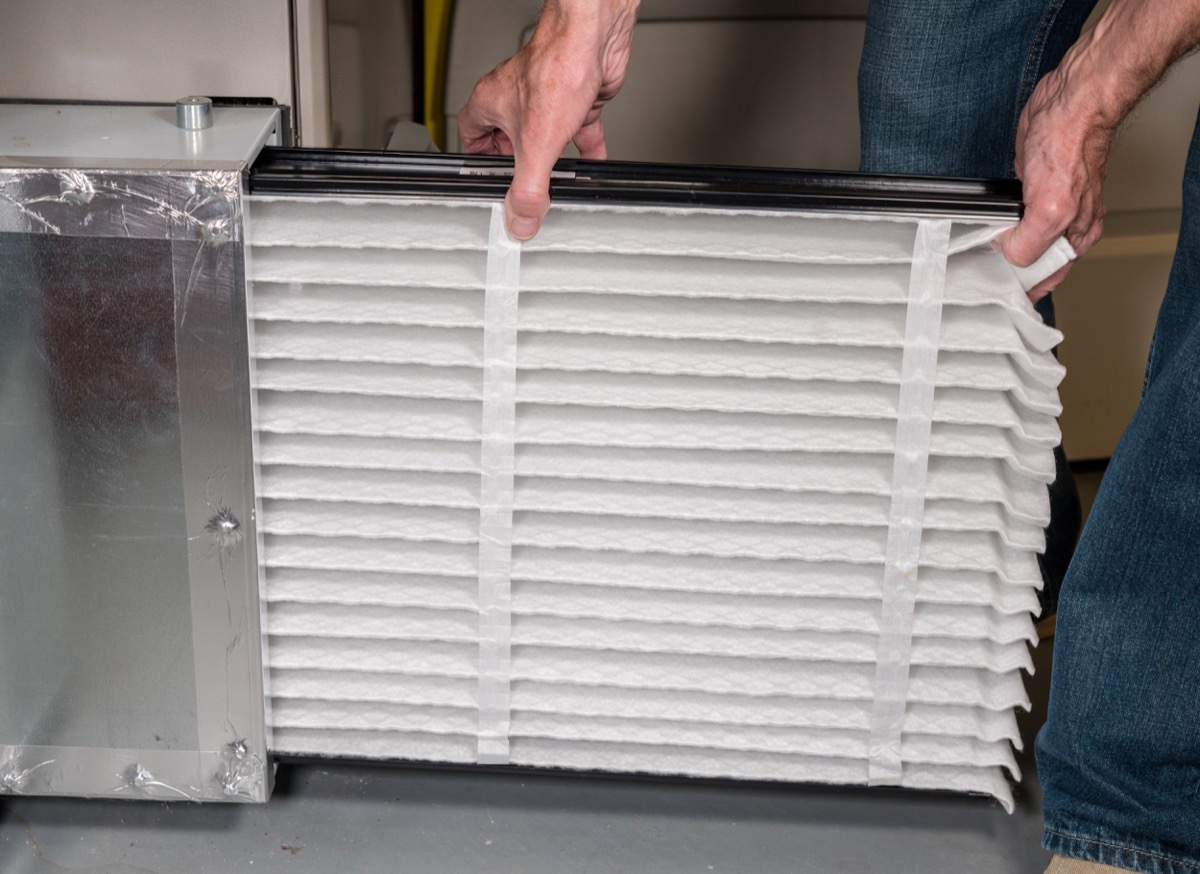 hand removing hvac filter