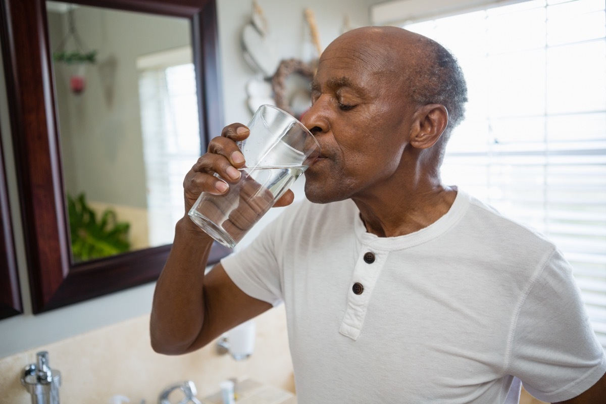 Man drinking from a glass