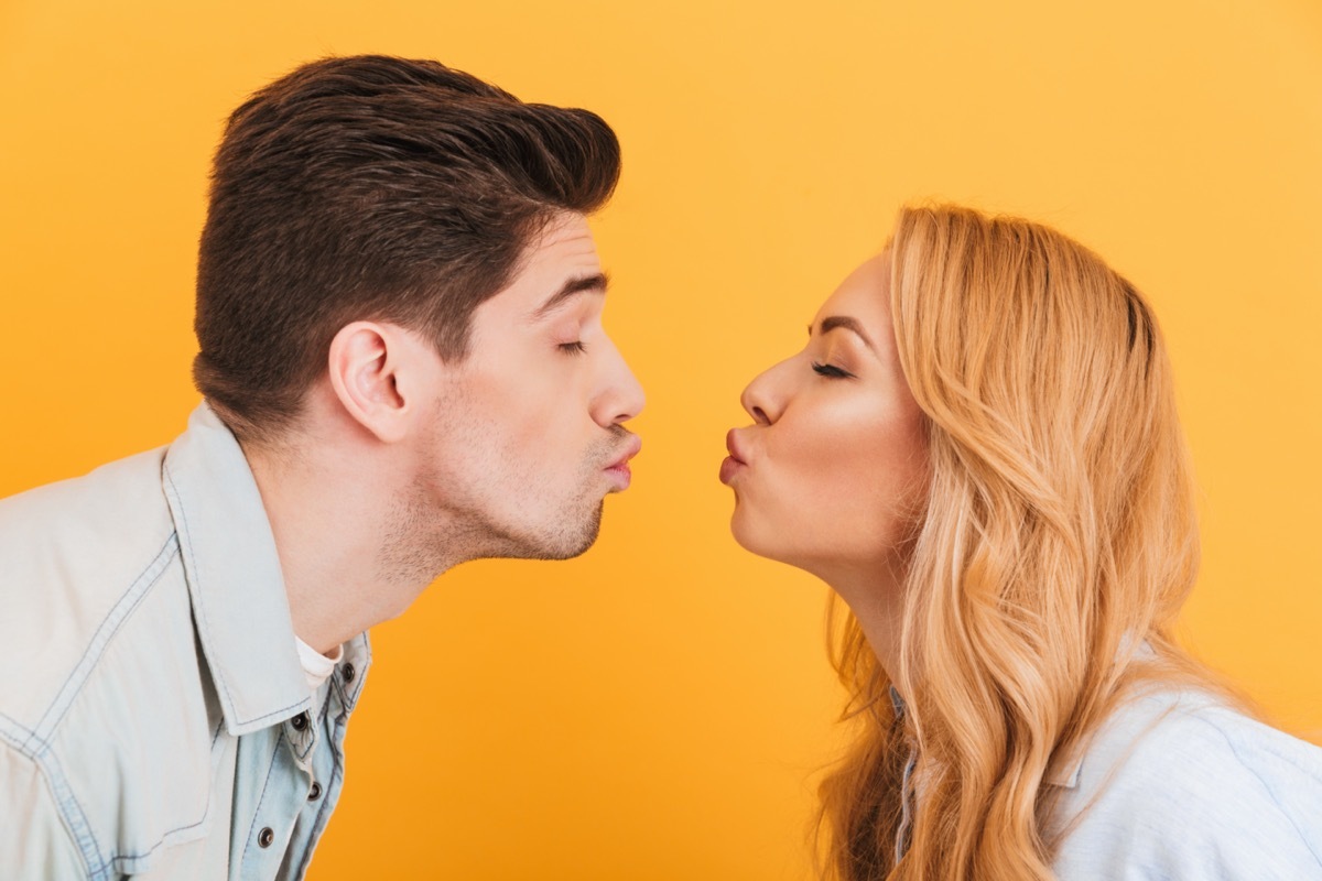 Young man and woman about to kiss