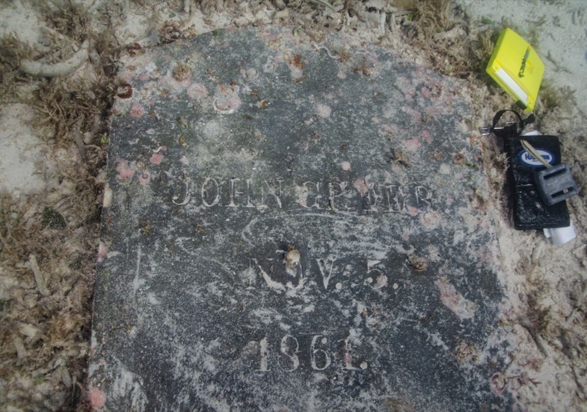 underwater headstone of john greer