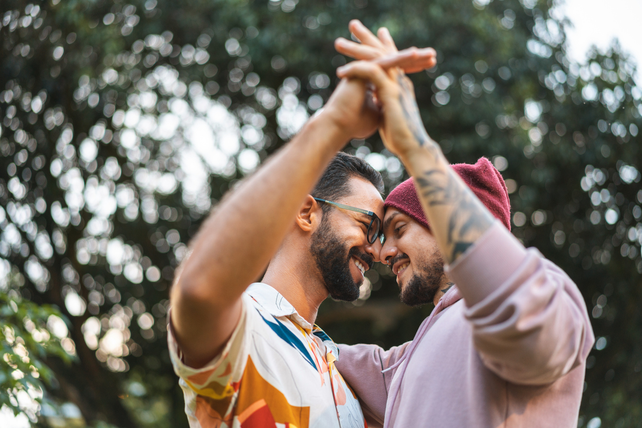 young gay couple spending time together outdoors