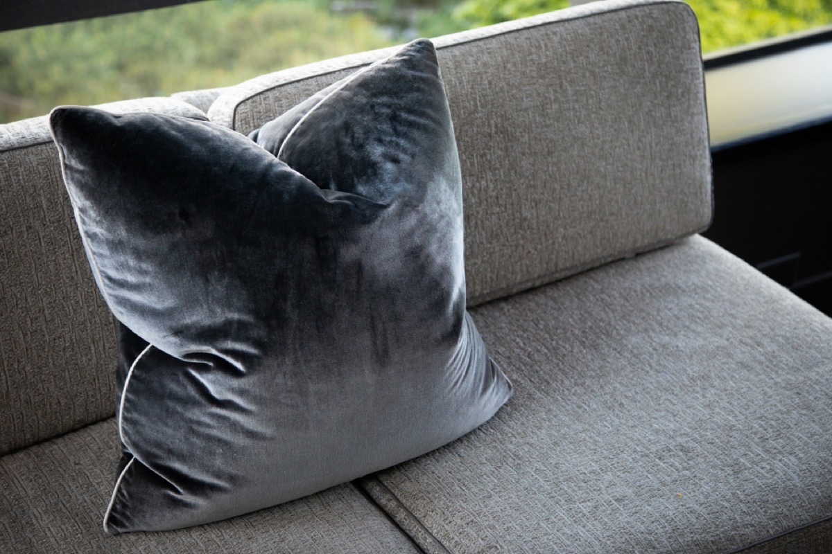 gray pillow on gray couch