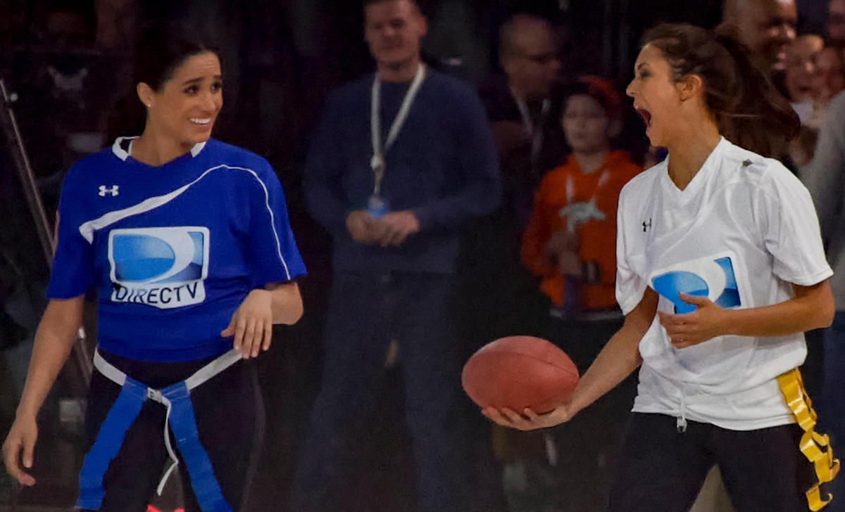 Meghan Markle, left, with Nina Dobrev at Directv's 8th Annual Celebrity Beach Bowl on February 1, 2014 in New York, NY