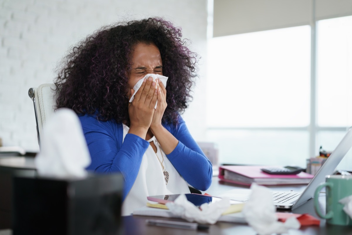 woman sneezing into tissue, relationship white lies