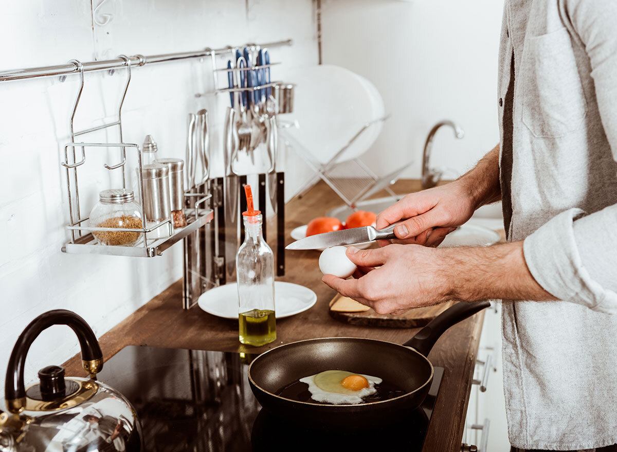 man cooking breakfast