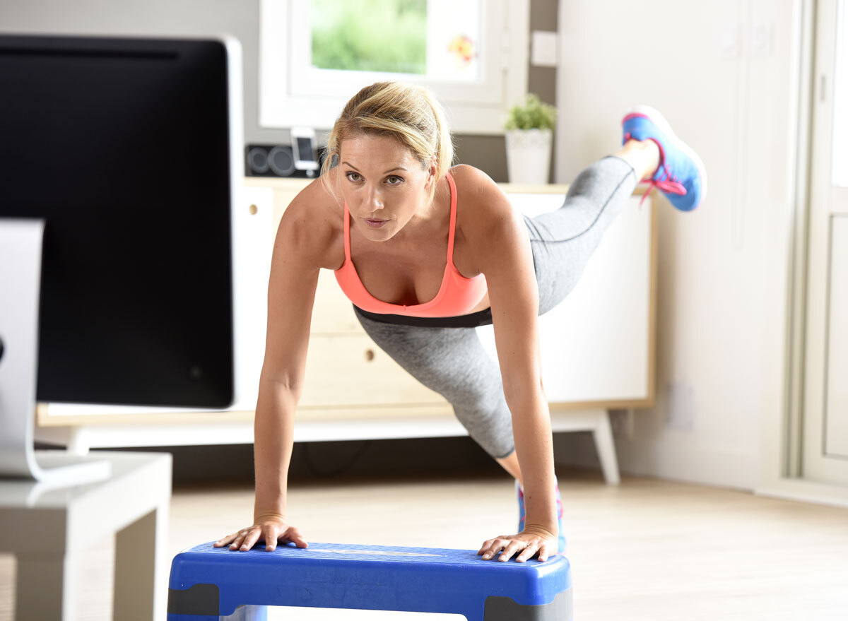 woman working out in front of tv