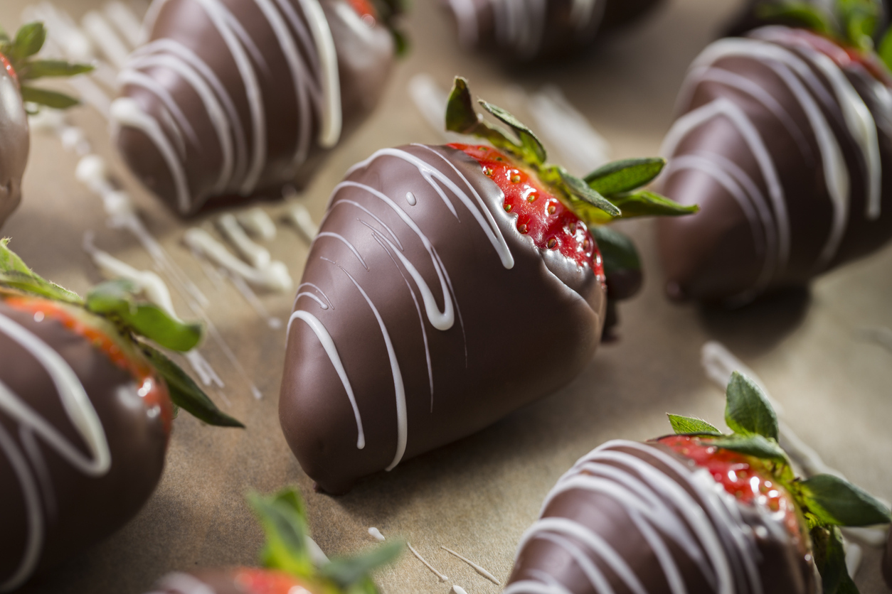 Chocolate covered strawberries with milk chocolate and white chocolate