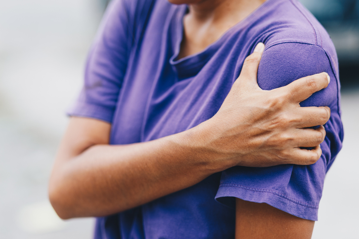 Young woman has pain in left arm after getting vaccinated