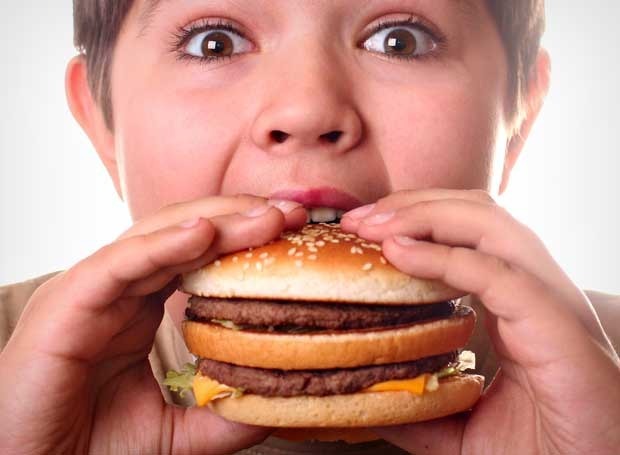 Kid eating burger