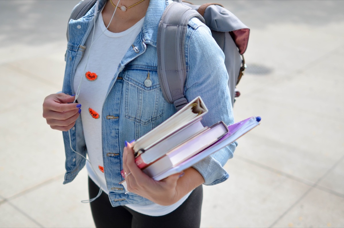 woman holding school supplies, back to school quotes