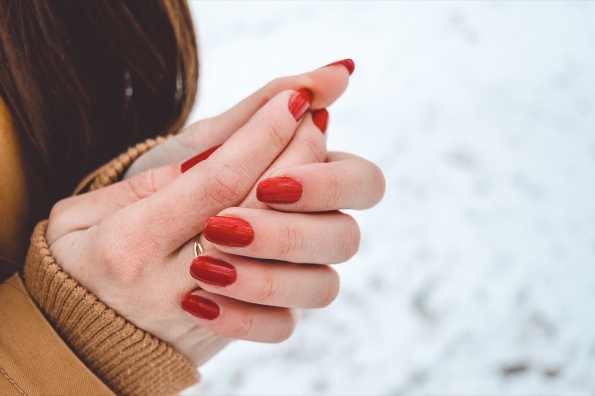 girl rubbing her hands outdoors