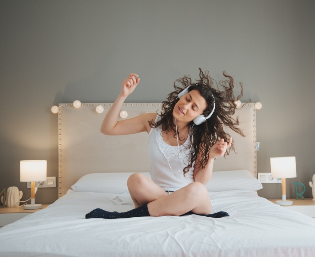 teen listening to music and dancing