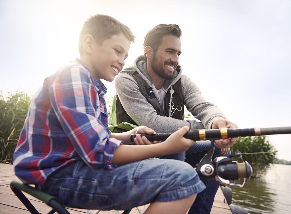 father and son fishing happier