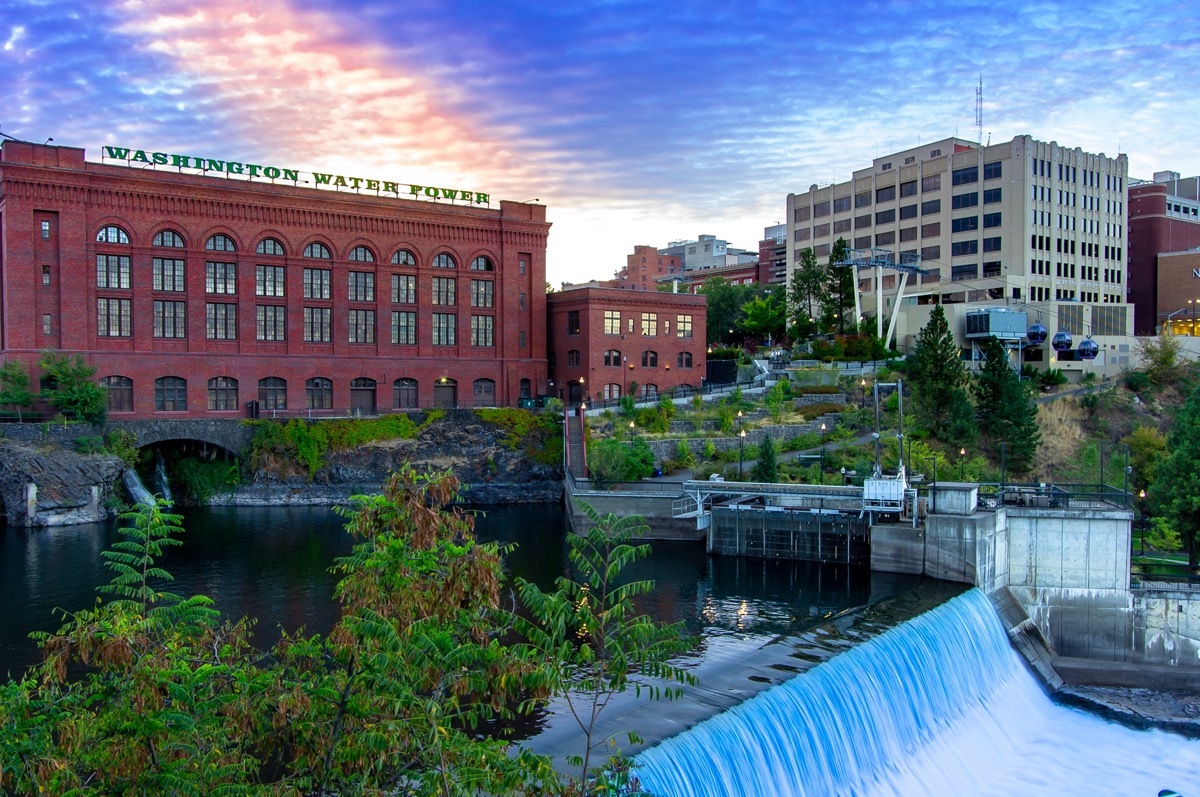 cityscape photo of a flowing river, lake, and buildings in downtown Spokane, Washington