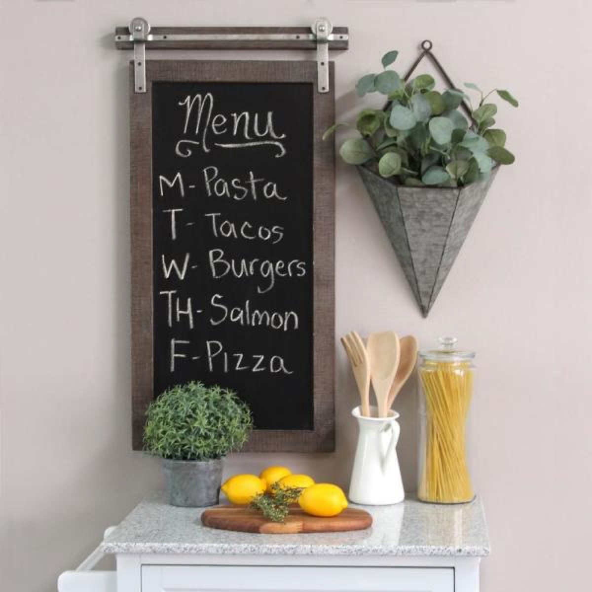 chalkboard sign above white table with plant next to it, rustic farmhouse decor