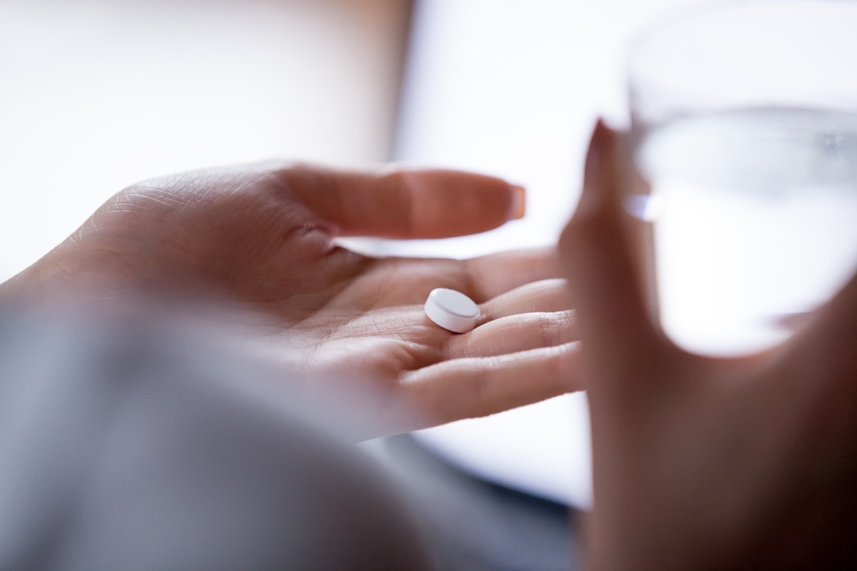 woman taking medication