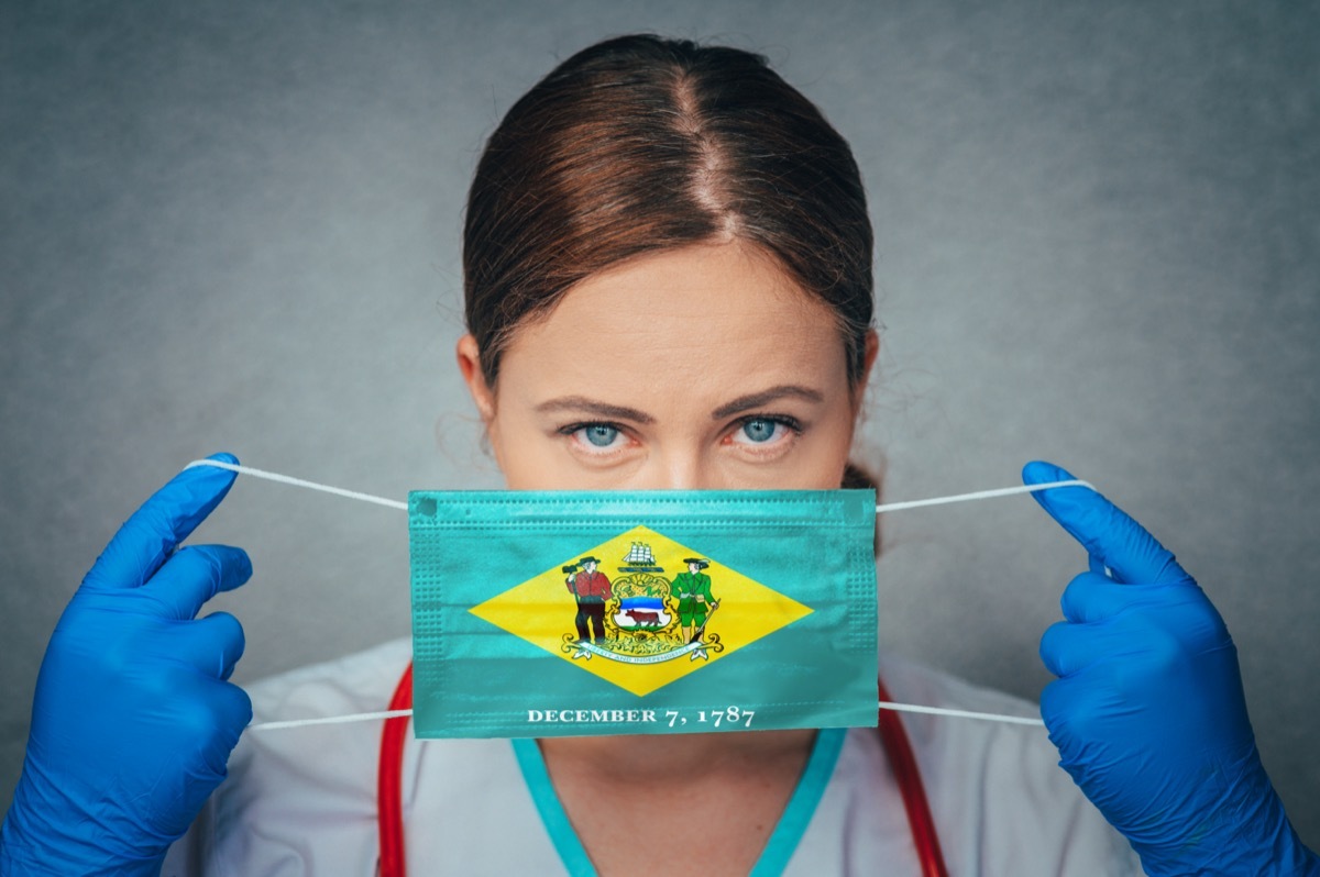 Female Doctor Portrait, protect Face surgical medical mask with Delaware Flag.