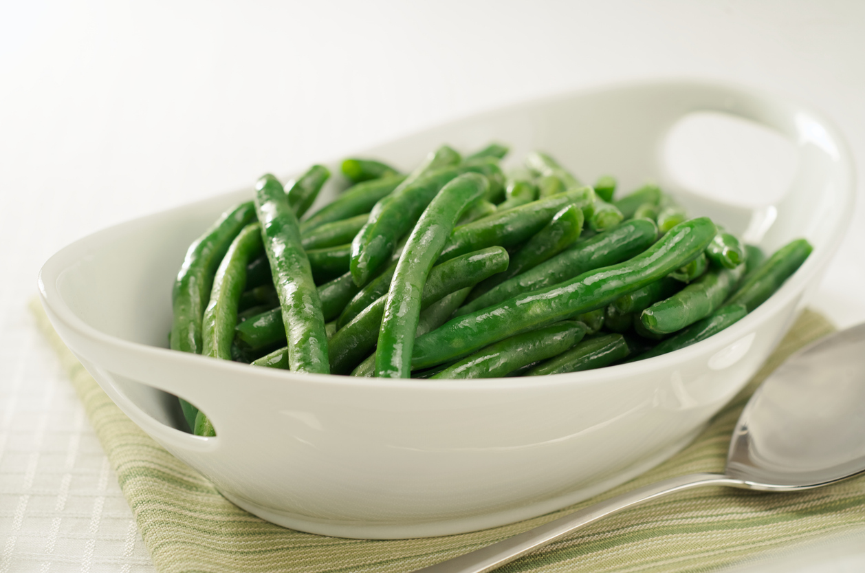 A bowl of cooked green beans