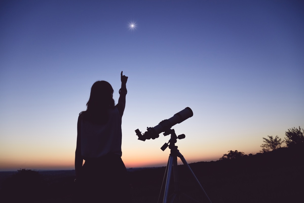 stargazing pointing at night sky