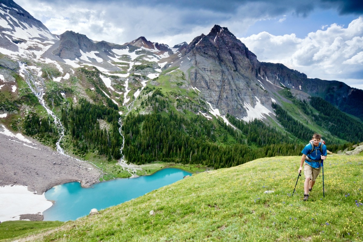 A hiker above lower Blue Lake near Ouray Colorado