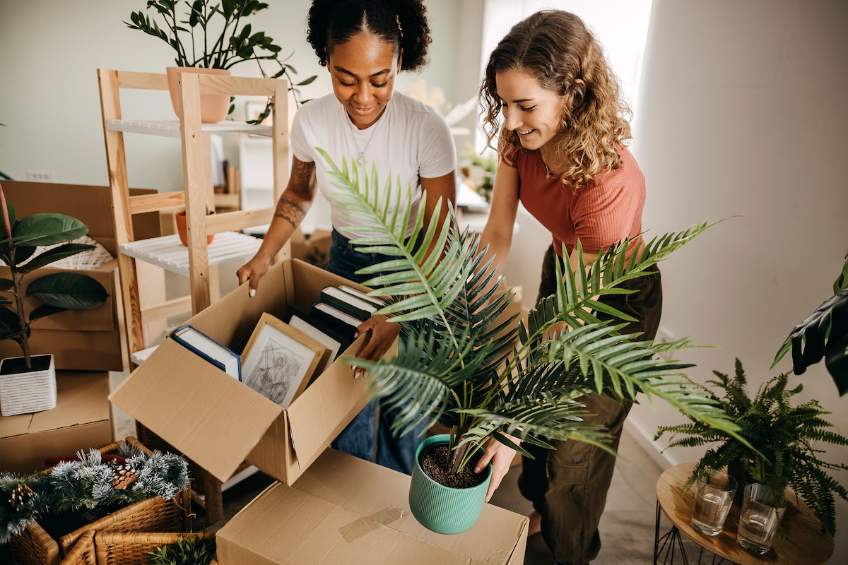 A female friend helping her female friend move