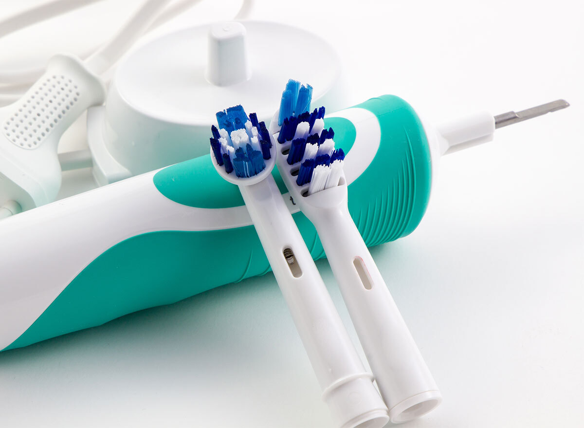 electric toothbrush with two heads