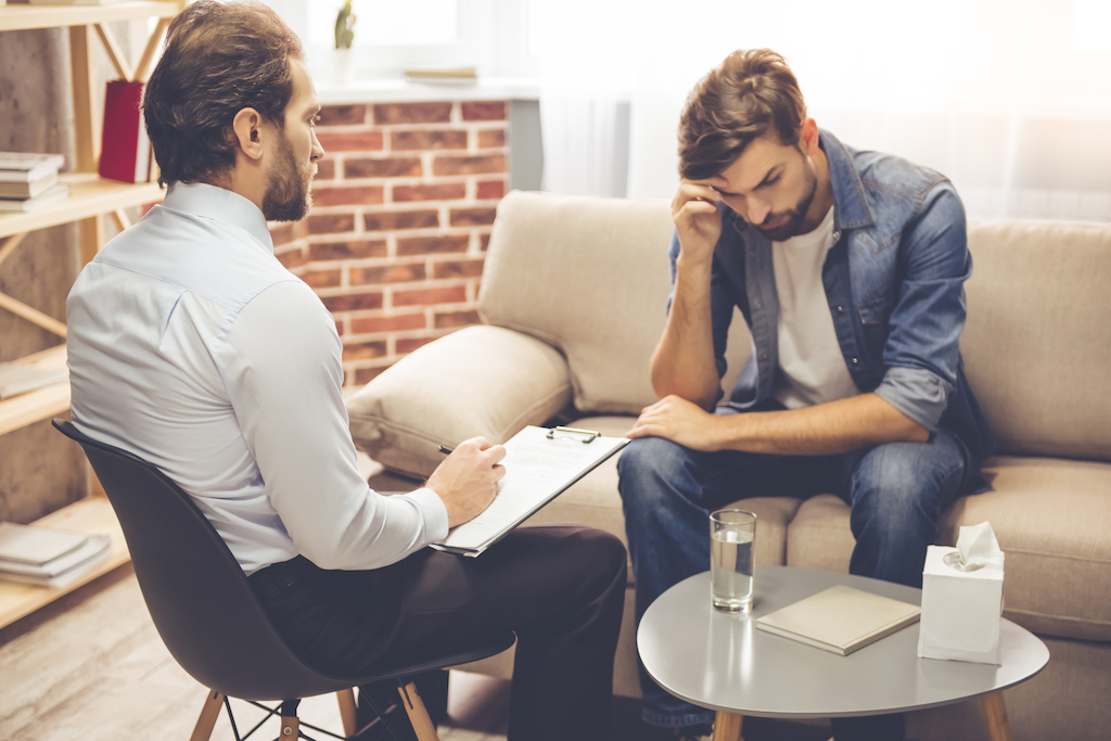 man talking to male therapist