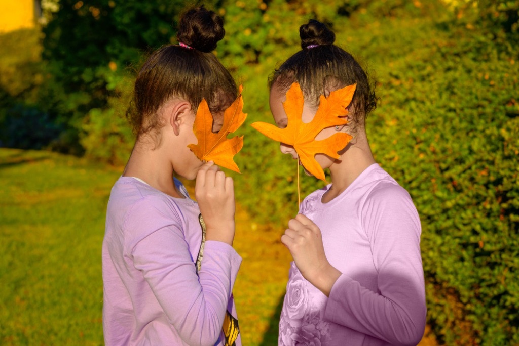 twin girls playing outside