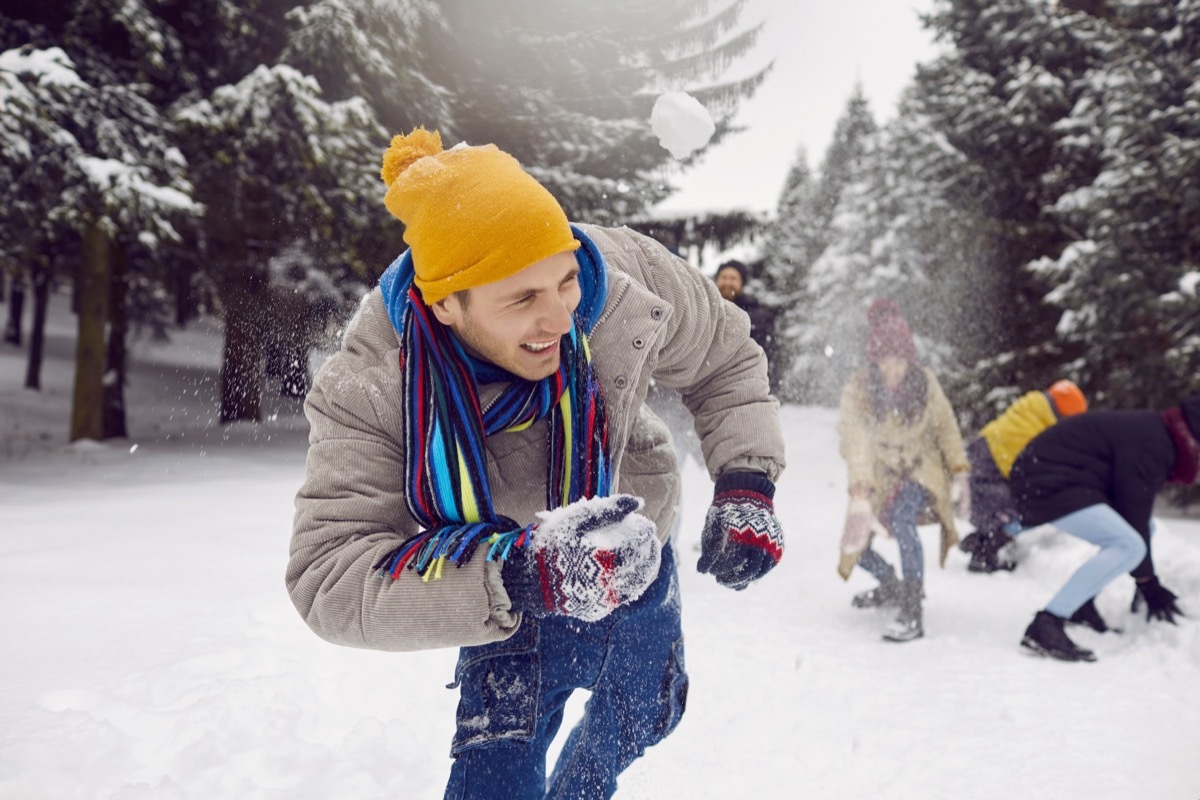 friends enjoying a snowball fight