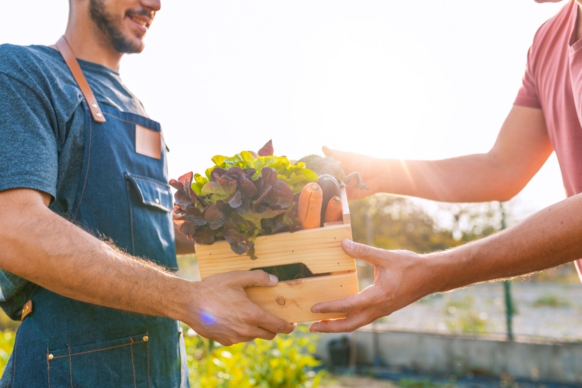 Locally grown produce in wooden crate