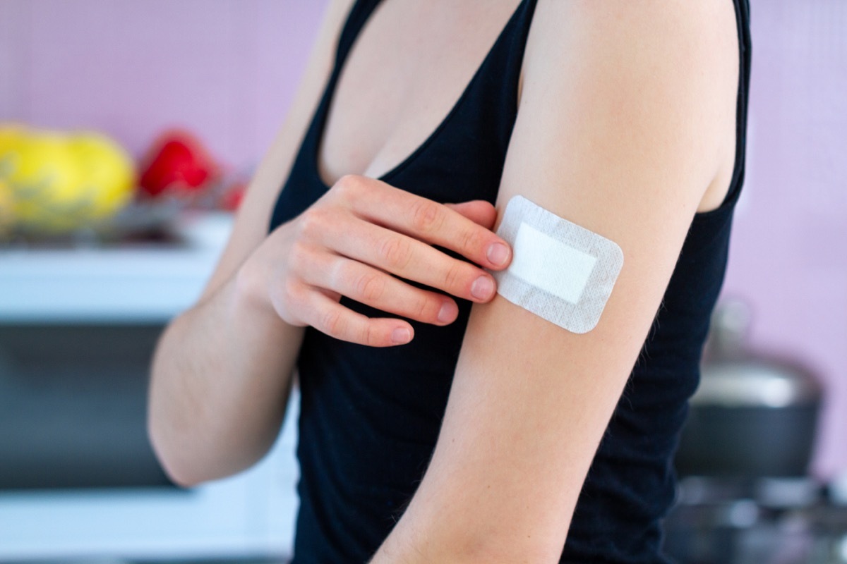 Woman with a bandaid on her healing wound