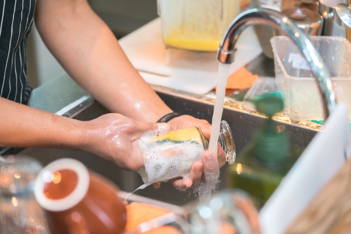 washing dishes in sink