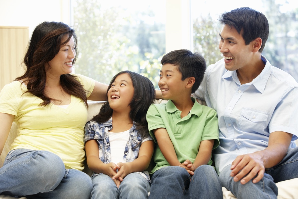 Family talking on couch