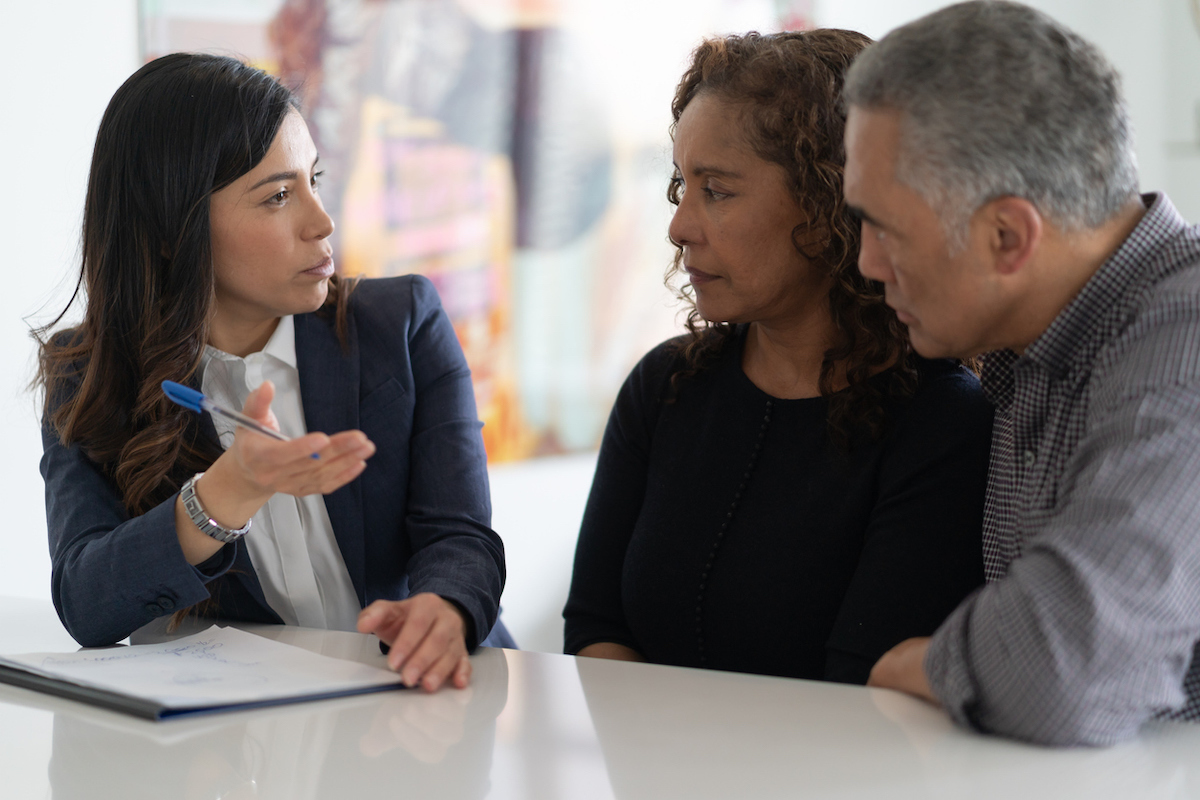 Couple are in a meeting with their financial advisor.