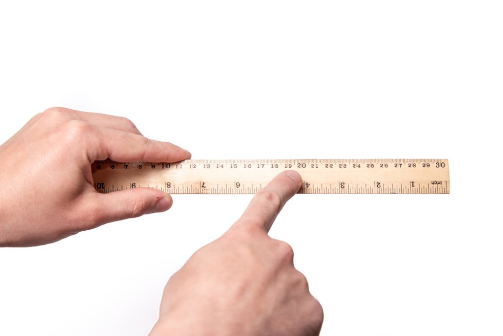 Man holding ruler, hard math problems