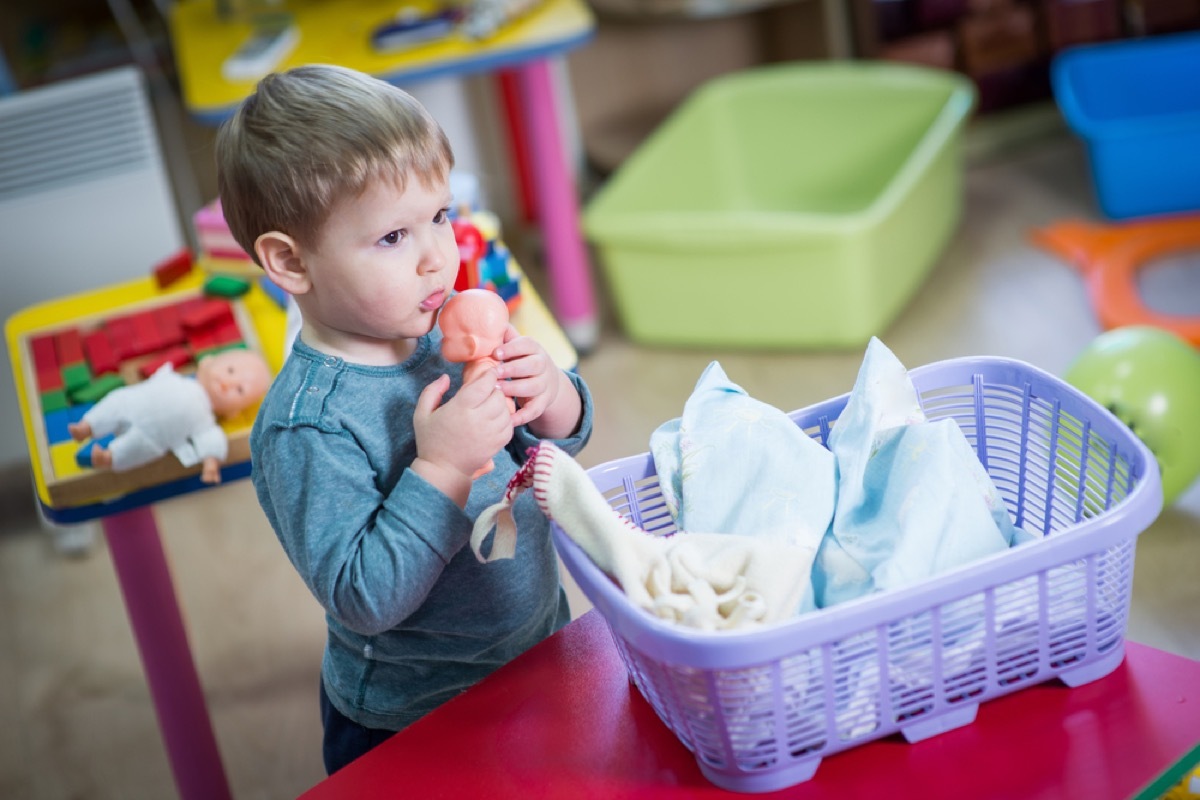 boy playing with doll things grandparents should never do