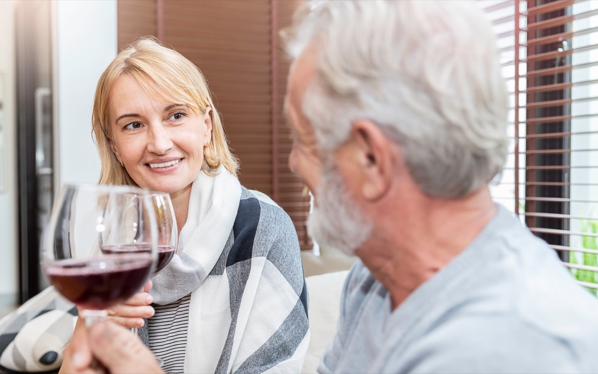 Couple clinking glasses of wine